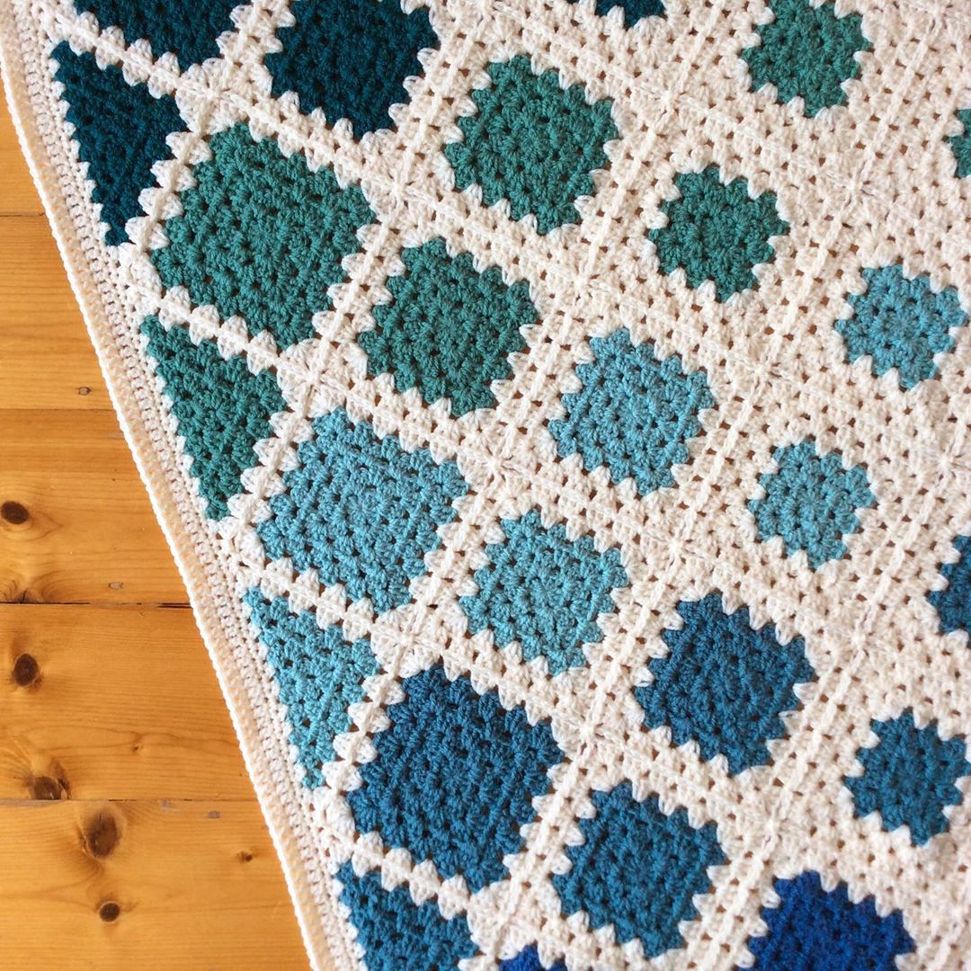 Adding a simple border to my Spin Your Granny Square throw blanket today.Ive done four rounds and …
